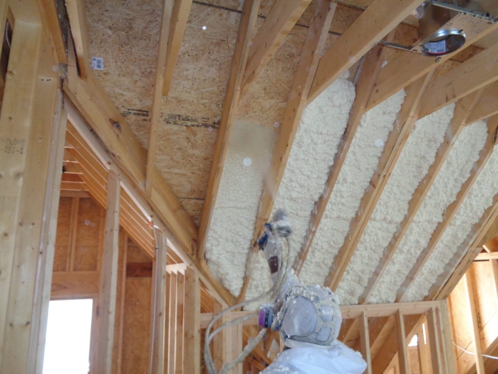 Closed-cell spray foam in wall stud bays